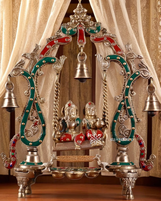 Brassaura™ Brass Radha Krishna Swing Idol with Diyas, Peacocks & Bells – Height 13.5 Inches & Weight 2.4 Kgs | Elegant Devotional Statue
