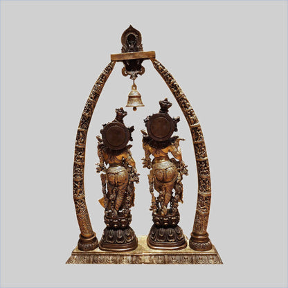 Brassaura® Radha Krishna Under Decorative Arch with Bell | Two-Tone Finish Brass Sculpture | Height 45 Inches & Weight 63 Kgs