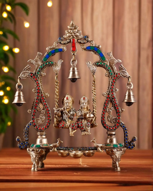 Brassaura™ Brass Radha Krishna Swing Idol with Diyas, Peacocks & Bells – Height 13.5 Inches & Weight 2.4 Kgs | Elegant Devotional Statue
