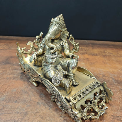 Brassaura® Reclining Ganesha Brass Idol on Peacock Chaise | Premium Solid Brass Lord Ganesha Statue | Handcrafted Antique Finish | Ganpati Murti for Home Temple, Living Room & Spiritual Décor | Height 7 Inches | 4.7 Kg