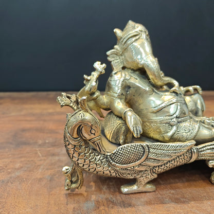 Brassaura® Reclining Ganesha Brass Idol on Peacock Chaise | Premium Solid Brass Lord Ganesha Statue | Handcrafted Antique Finish | Ganpati Murti for Home Temple, Living Room & Spiritual Décor | Height 7 Inches | 4.7 Kg