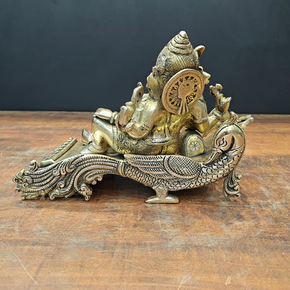 Brassaura® Reclining Ganesha Brass Idol on Peacock Chaise | Premium Solid Brass Lord Ganesha Statue | Handcrafted Antique Finish | Ganpati Murti for Home Temple, Living Room & Spiritual Décor | Height 7 Inches | 4.7 Kg