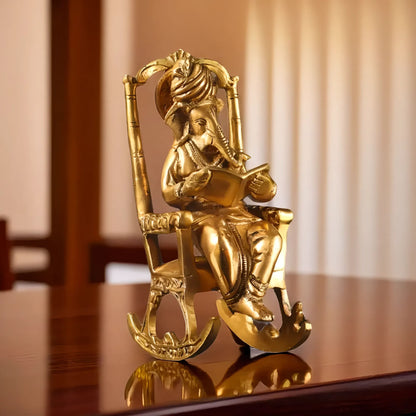 Brassaura® Brass Ganesha on Rocking Chair Reading Mahabharata | Height 7.5 Inches