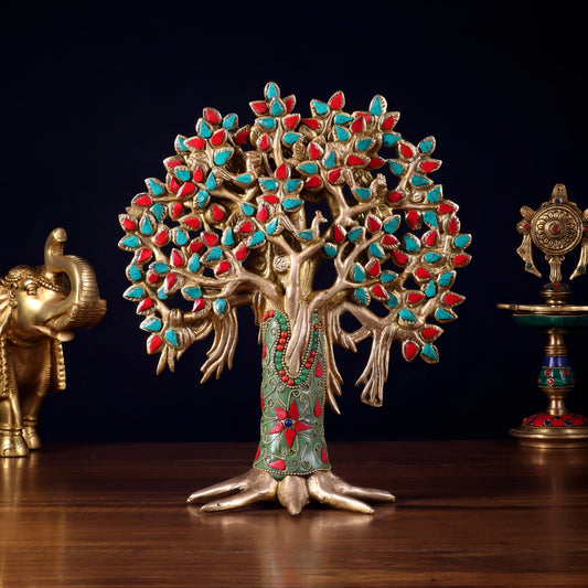 Decorative tree figurine with colorful leaves on a dark background