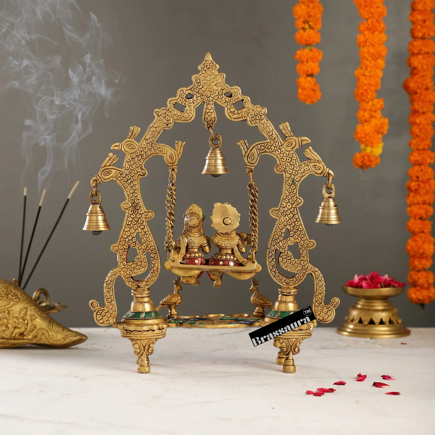 Brassaura™ Brass Radha Krishna on Swing with Diyas, Peacocks & Bells – Height 13.5 Inches & Weight 2.4 Kgs | Elegant Devotional Idol