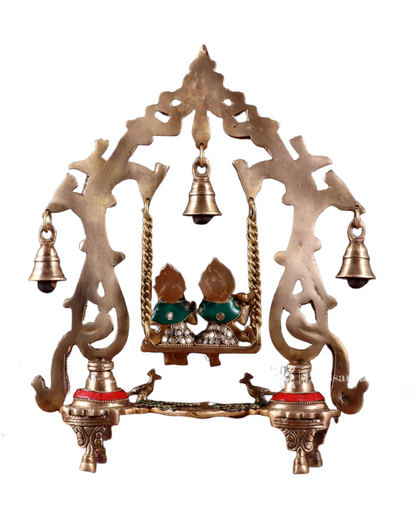 Brassaura™ Brass Radha Krishna Swing Idol with Diyas, Peacocks & Bells – Height 13.5 Inches & Weight 2.4 Kgs | Elegant Devotional Statue