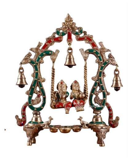 Brassaura™ Brass Radha Krishna Swing Idol with Diyas, Peacocks & Bells – Height 13.5 Inches & Weight 2.4 Kgs | Elegant Devotional Statue