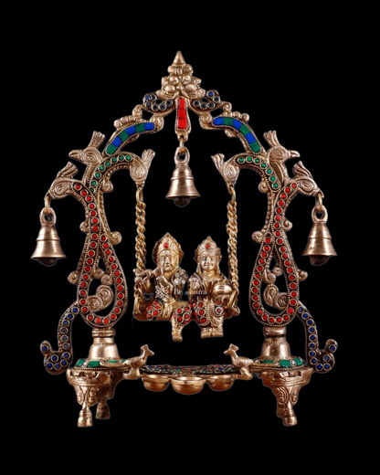 Brassaura™ Brass Radha Krishna Swing Idol with Diyas, Peacocks & Bells – Height 13.5 Inches & Weight 2.4 Kgs | Elegant Devotional Statue