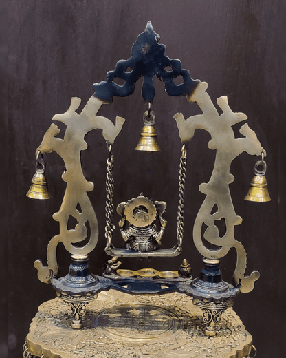 Brassaura® Brass Ganesha on Swing with Three Diyas, Peacocks & Bells | Height 13.5 Inches