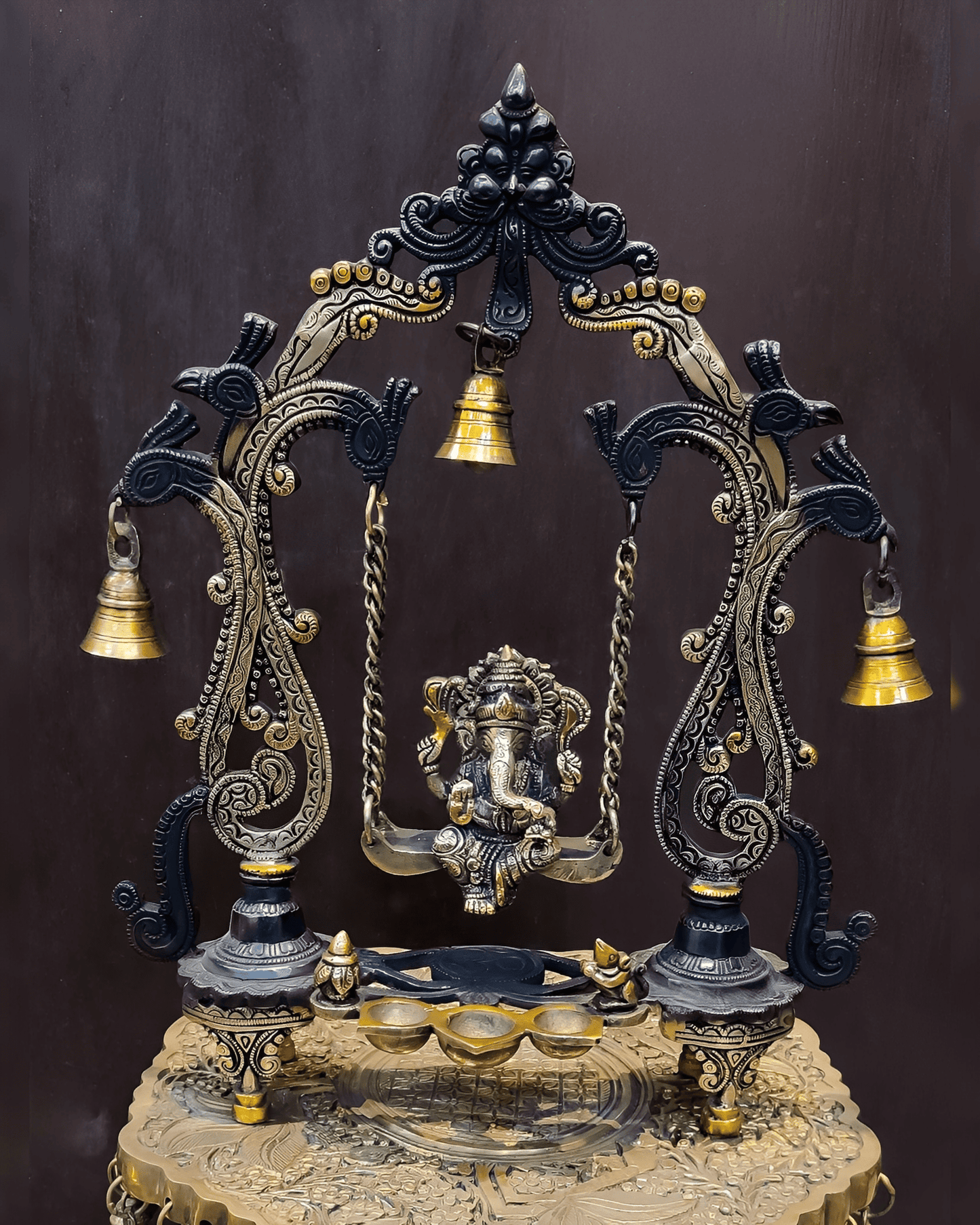 Brassaura® Brass Ganesha on Swing with Three Diyas, Peacocks & Bells | Height 13.5 Inches