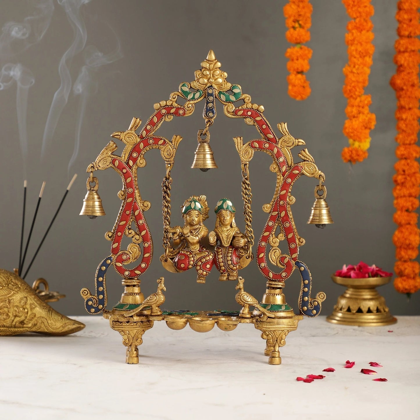 Brassaura™ Brass Radha Krishna on Swing with Diyas, Peacocks & Bells – Height 13.5 Inches & Weight 2.4 Kgs | Elegant Devotional Idol