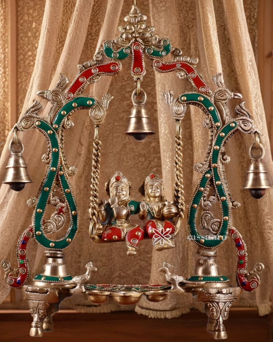 Brassaura™ Brass Radha Krishna Swing Idol with Diyas, Peacocks & Bells – Height 13.5 Inches & Weight 2.4 Kgs | Elegant Devotional Statue
