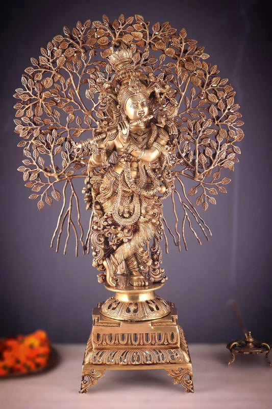 ब्रासौरा™ हस्तनिर्मित पीतल की भगवान कृष्ण कल्पवृक्ष के साथ प्रतिमा – ऊँचाई 36 इंच और वज़न 32 किलोग्राम